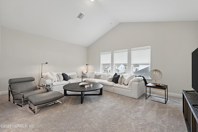 living room featuring high vaulted ceiling, baseboards, visible vents, and carpet flooring