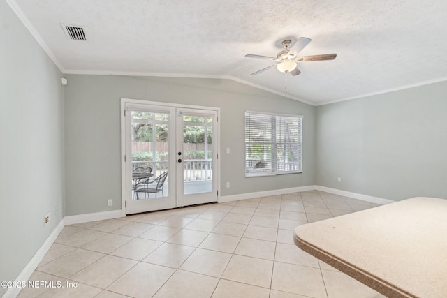 interior space featuring visible vents, lofted ceiling, ceiling fan, french doors, and a textured ceiling