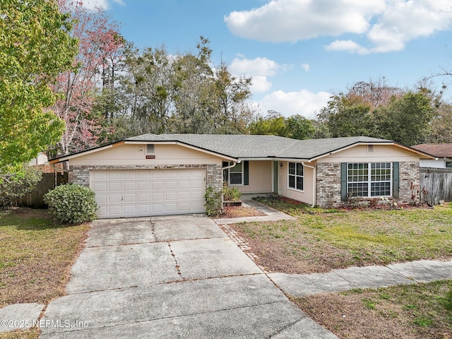 ranch-style home featuring a front yard, fence, a garage, and driveway