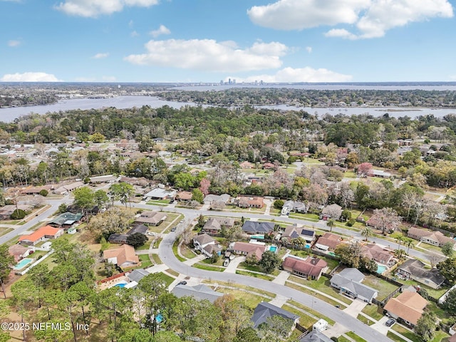 birds eye view of property with a residential view and a water view