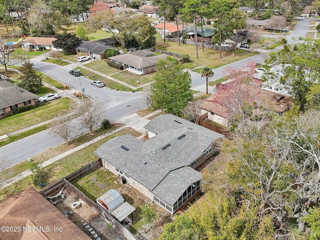 birds eye view of property with a residential view