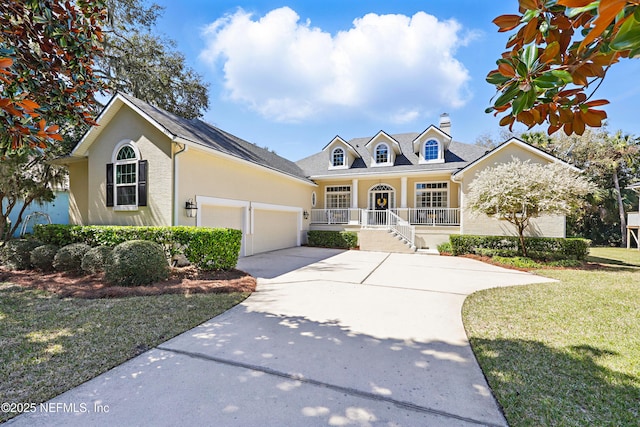 view of front of house featuring stucco siding, a porch, concrete driveway, a front yard, and a garage