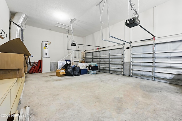 garage with electric water heater and a garage door opener