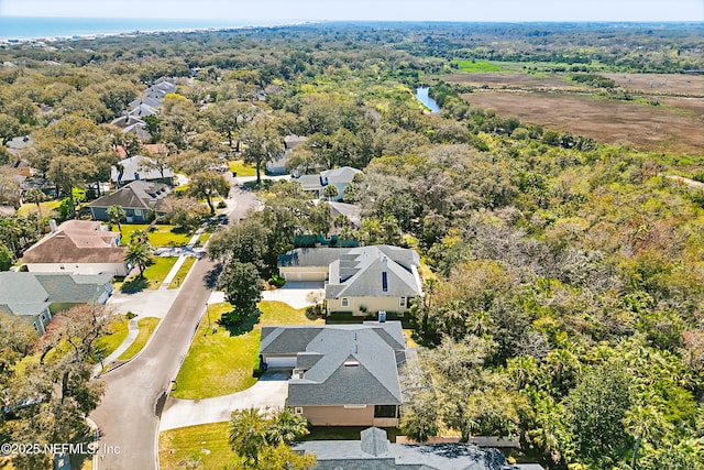 bird's eye view with a residential view and a wooded view