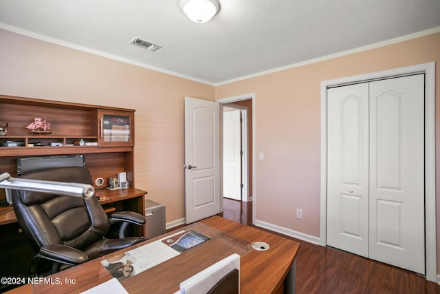 home office featuring crown molding, dark wood finished floors, visible vents, and baseboards