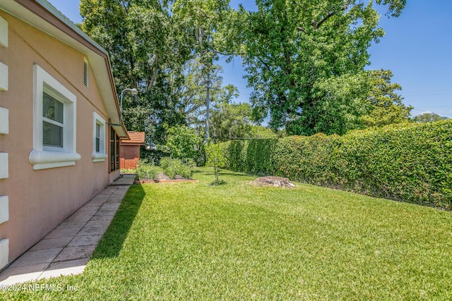 view of yard with a fenced backyard