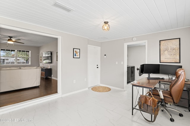 office featuring marble finish floor, washer and clothes dryer, visible vents, and baseboards