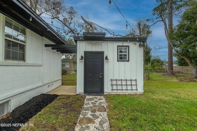 view of shed with fence