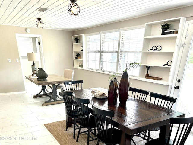 dining area with baseboards, visible vents, wood ceiling, and plenty of natural light