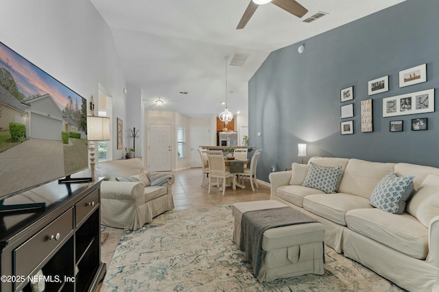 living room featuring high vaulted ceiling, visible vents, a ceiling fan, and light tile patterned flooring