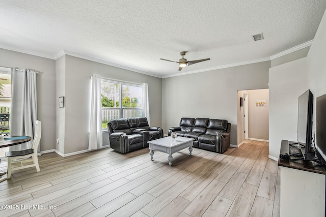 living area with ornamental molding, a ceiling fan, visible vents, and wood tiled floor