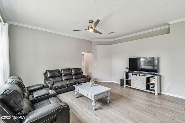 living area with wood tiled floor, a textured ceiling, ceiling fan, and crown molding