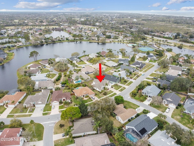 bird's eye view with a residential view and a water view