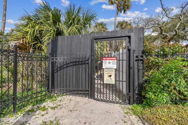 view of gate with fence