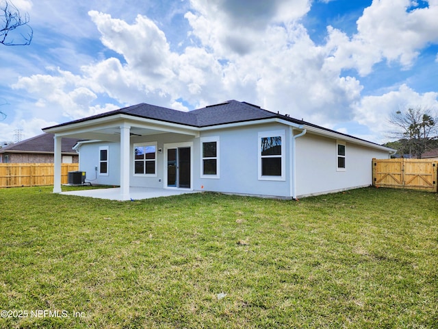 back of house with a patio area, a fenced backyard, cooling unit, and a yard