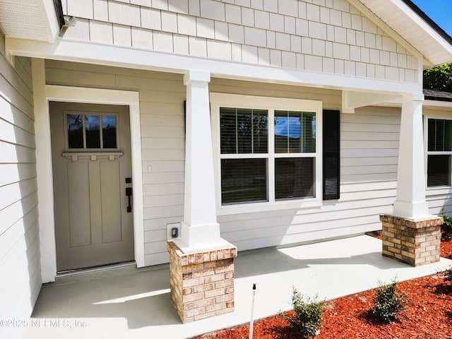 entrance to property with covered porch