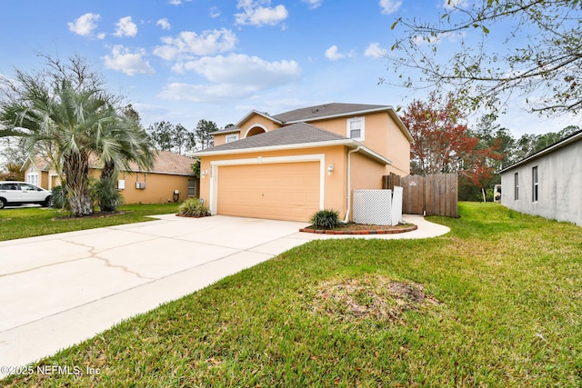 view of front of house featuring concrete driveway, stucco siding, an attached garage, fence, and a front yard