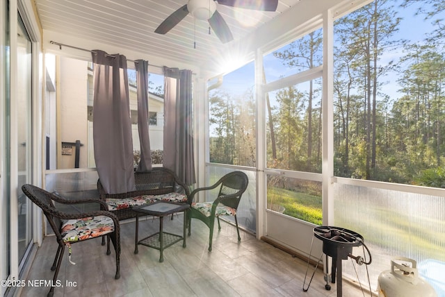 sunroom / solarium with ceiling fan