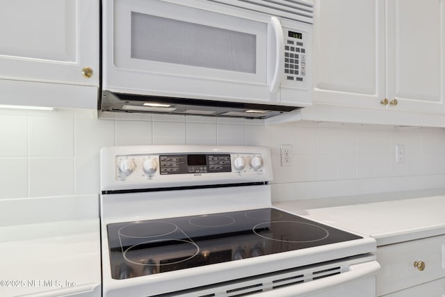 details featuring light countertops, white appliances, white cabinets, and backsplash