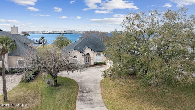 exterior space with a water view