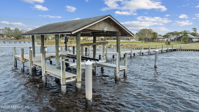 dock area featuring a water view and boat lift