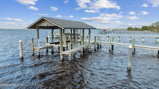 view of dock featuring a water view and boat lift