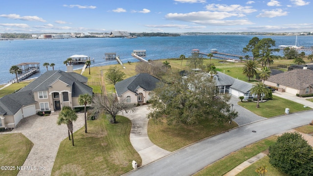 birds eye view of property with a water view