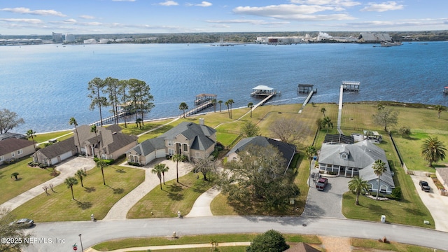 bird's eye view featuring a residential view and a water view