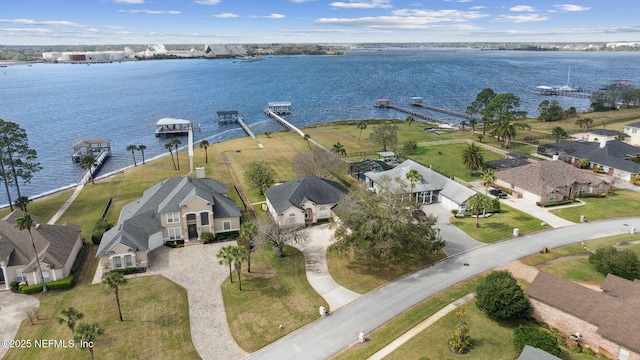 bird's eye view featuring a residential view and a water view