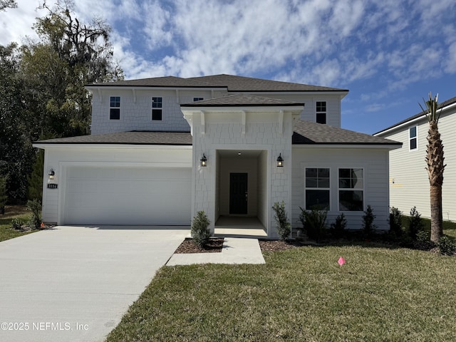 view of front facade with a garage, driveway, a front lawn, and a shingled roof