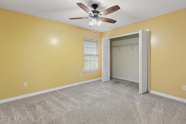 unfurnished bedroom with carpet floors, a ceiling fan, baseboards, and a closet