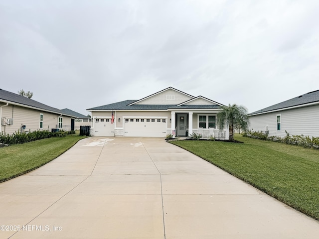 view of front of property featuring a porch, an attached garage, a front yard, fence, and driveway