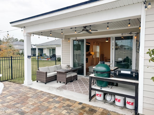 view of patio with ceiling fan and fence