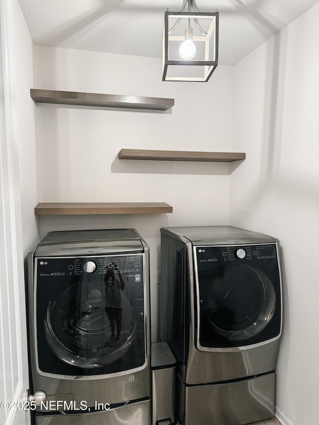 clothes washing area featuring laundry area and independent washer and dryer