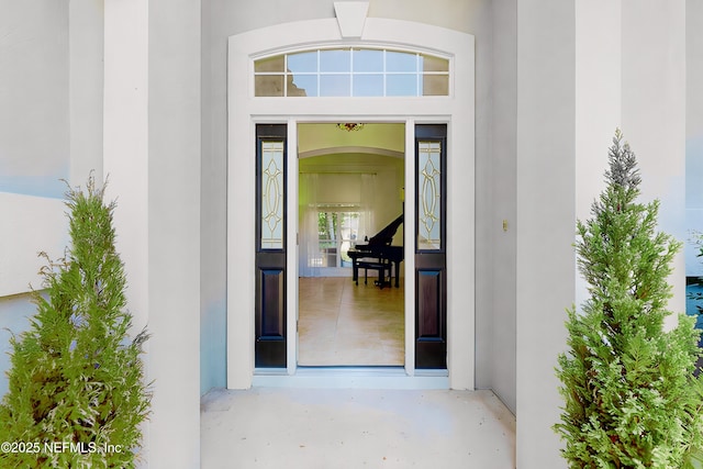 doorway to property with stucco siding