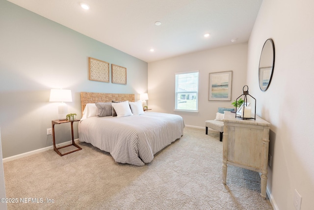 bedroom with recessed lighting, light colored carpet, and baseboards