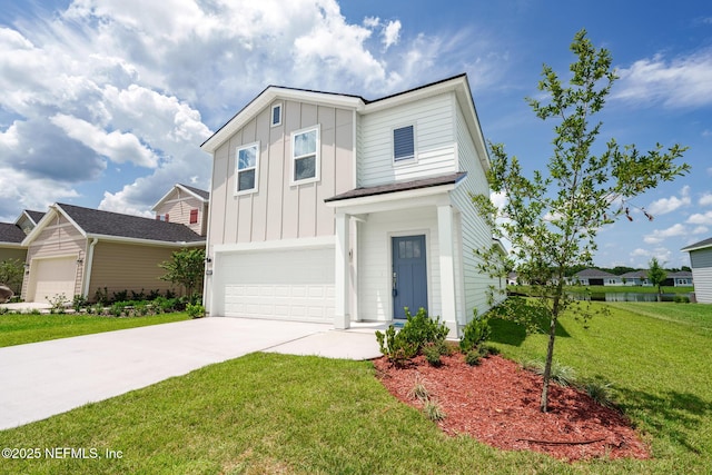 traditional-style home featuring a garage, driveway, board and batten siding, and a front yard