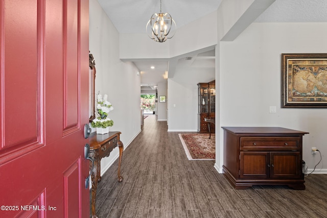 352 Bronson Pkwy, Saint Augustine, FL 32095 - foyer featuring a chandelier and dark wood-style flooring