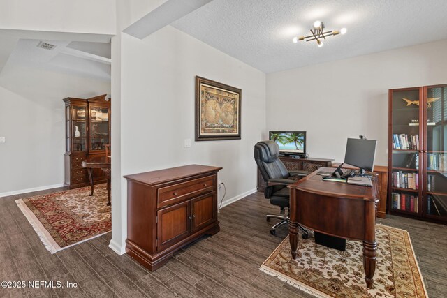 352 Bronson Pkwy, Saint Augustine, FL 32095 - office area featuring dark wood-style floors and a textured ceiling