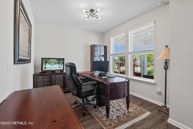352 Bronson Pkwy, Saint Augustine, FL 32095 - office space with dark wood finished floors, a textured ceiling, and a chandelier