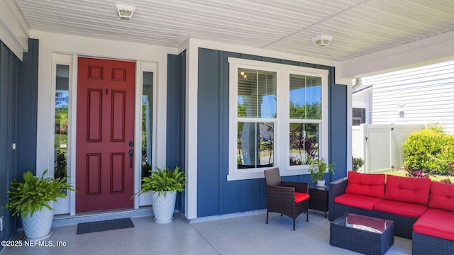 352 Bronson Pkwy, Saint Augustine, FL 32095 - doorway to property featuring covered porch, board and batten siding, and an outdoor hangout area