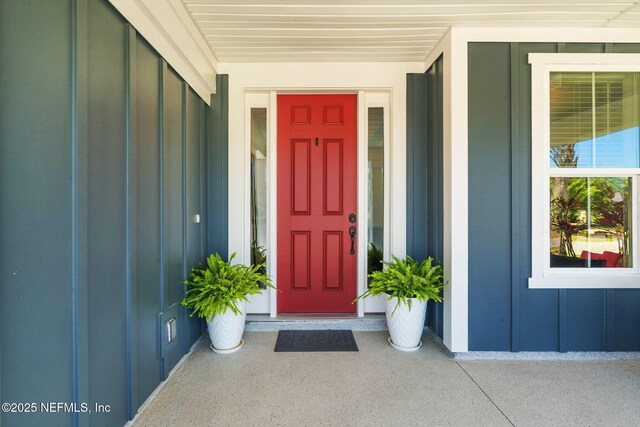 352 Bronson Pkwy, Saint Augustine, FL 32095 - view of exterior entry featuring board and batten siding and covered porch