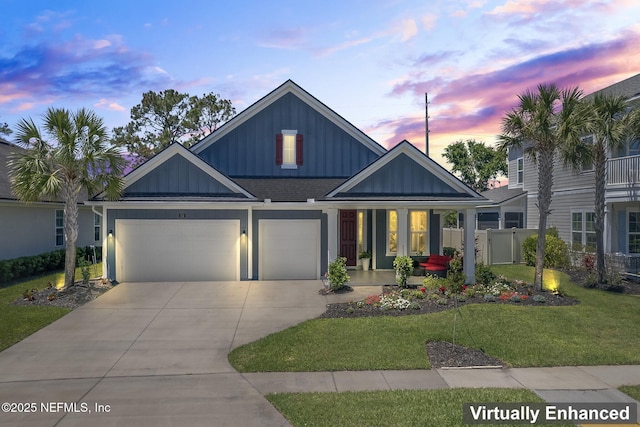 352 Bronson Pkwy, Saint Augustine, FL 32095 - view of front of property featuring board and batten siding, driveway, a garage, and covered porch