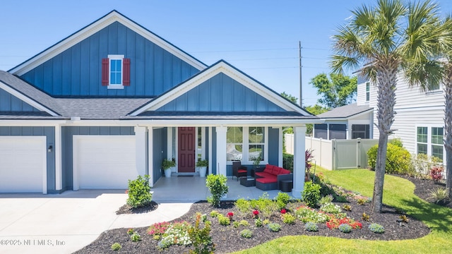 352 Bronson Pkwy, Saint Augustine, FL 32095 - view of front of house with board and batten siding, covered porch, a shingled roof, and driveway