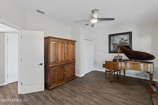 352 Bronson Pkwy, Saint Augustine, FL 32095 - sitting room with dark wood finished floors, ceiling fan, and a textured ceiling