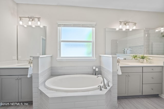 352 Bronson Pkwy, Saint Augustine, FL 32095 - bathroom featuring two vanities, a bath, and a tile shower