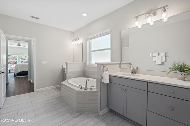 352 Bronson Pkwy, Saint Augustine, FL 32095 - bathroom with vanity, a bath, connected bathroom, a ceiling fan, and recessed lighting