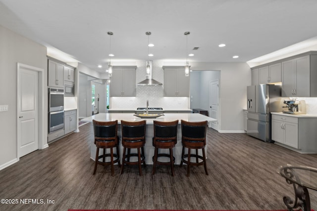 352 Bronson Pkwy, Saint Augustine, FL 32095 - kitchen with gray cabinetry, a kitchen island with sink, tasteful backsplash, appliances with stainless steel finishes, and recessed lighting