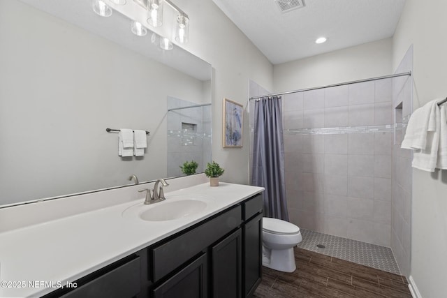 352 Bronson Pkwy, Saint Augustine, FL 32095 - full bath with vanity, tiled shower, and wood finished floors
