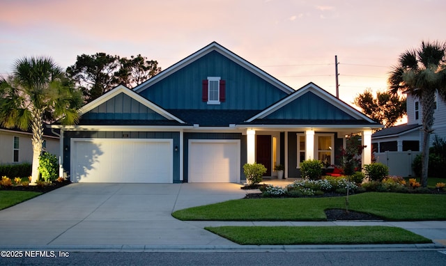 352 Bronson Pkwy, Saint Augustine, FL 32095 - craftsman inspired home featuring concrete driveway, board and batten siding, a porch, and a garage
